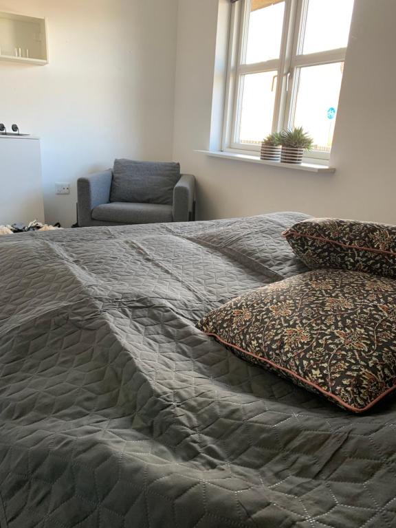 Postel nebo postele na pokoji v ubytování Hus i Løkken