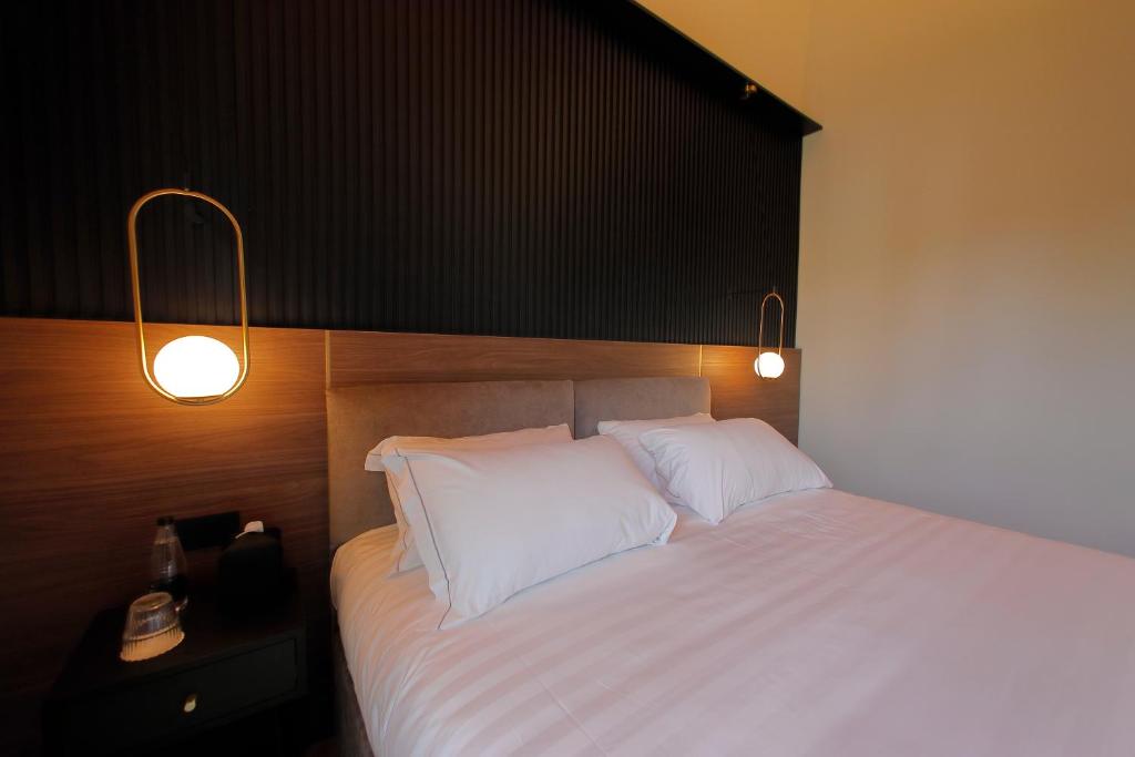 Postel nebo postele na pokoji v ubytování Hotel Namia by Dori