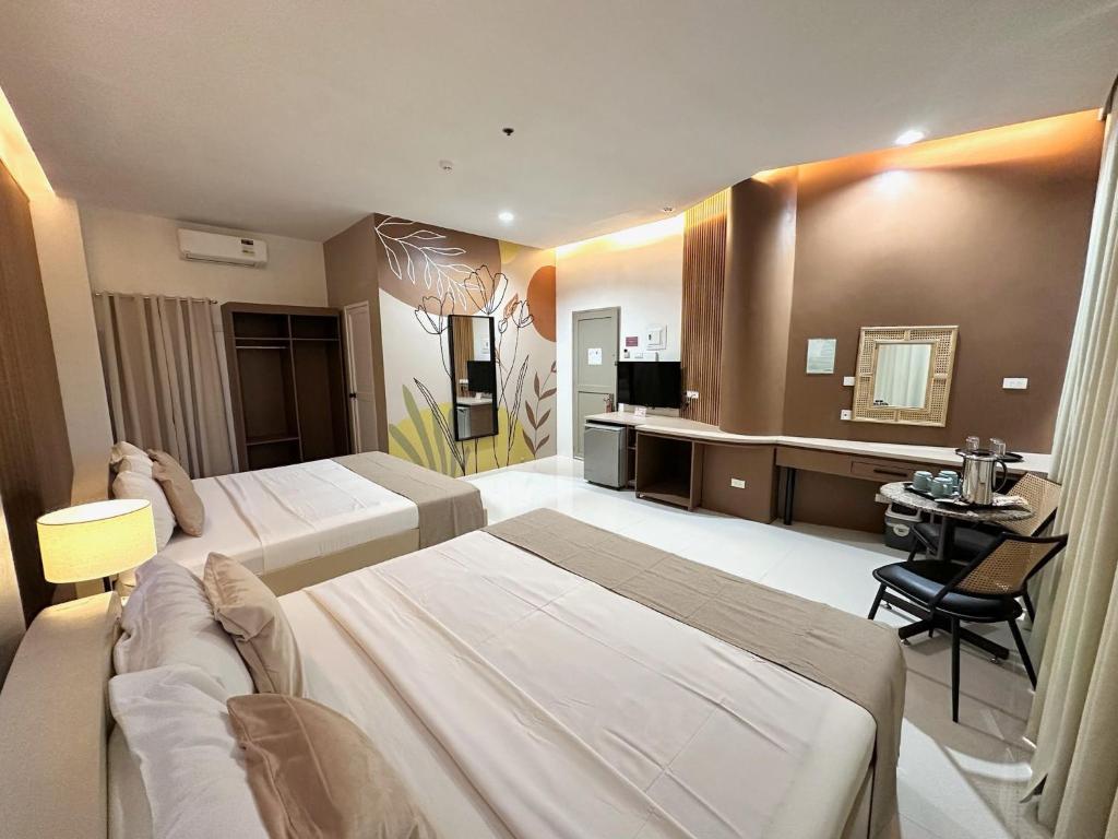 Postel nebo postele na pokoji v ubytování Hotel Nicanor