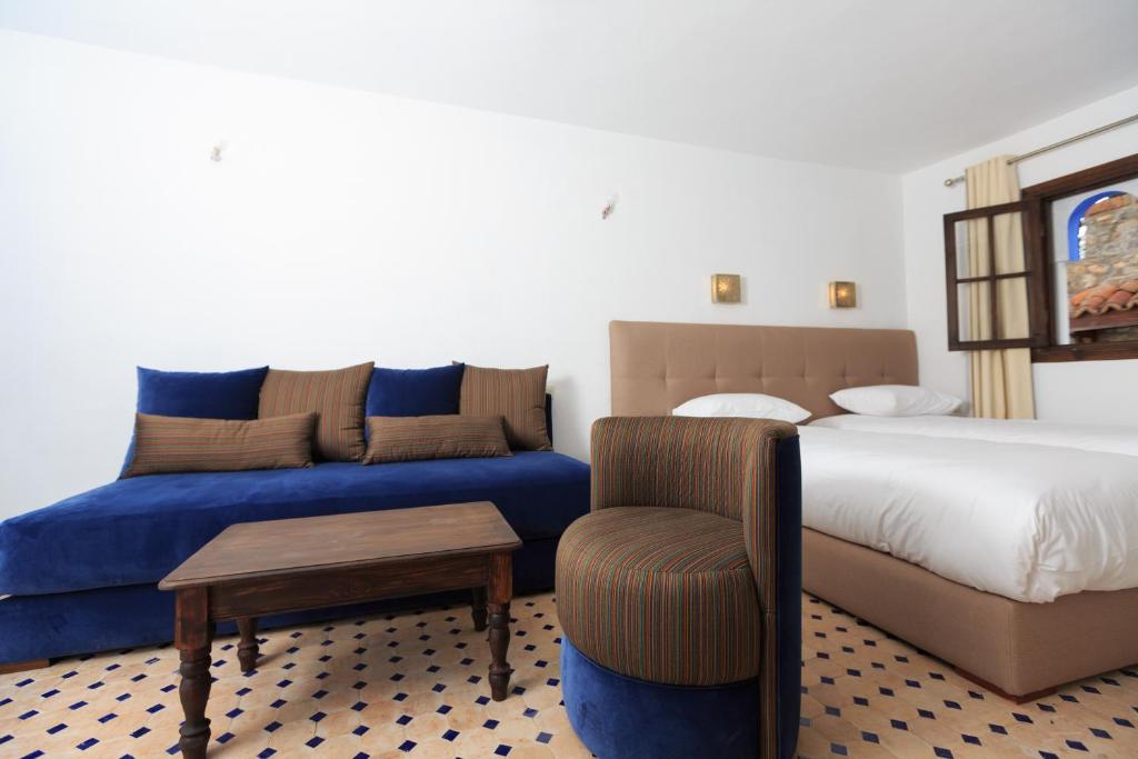 Postel nebo postele na pokoji v ubytování Riad Zaitouna Chaouen