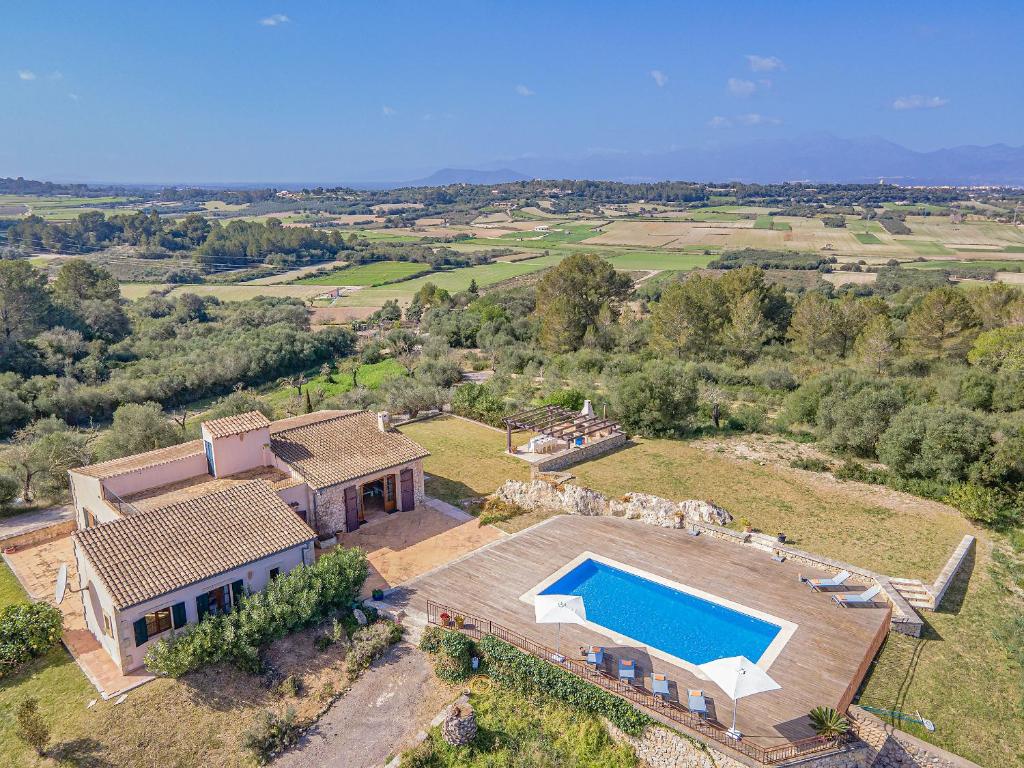 an aerial view of a house with a swimming pool at Finca Puig Blanc by Sealand Villas in Muro