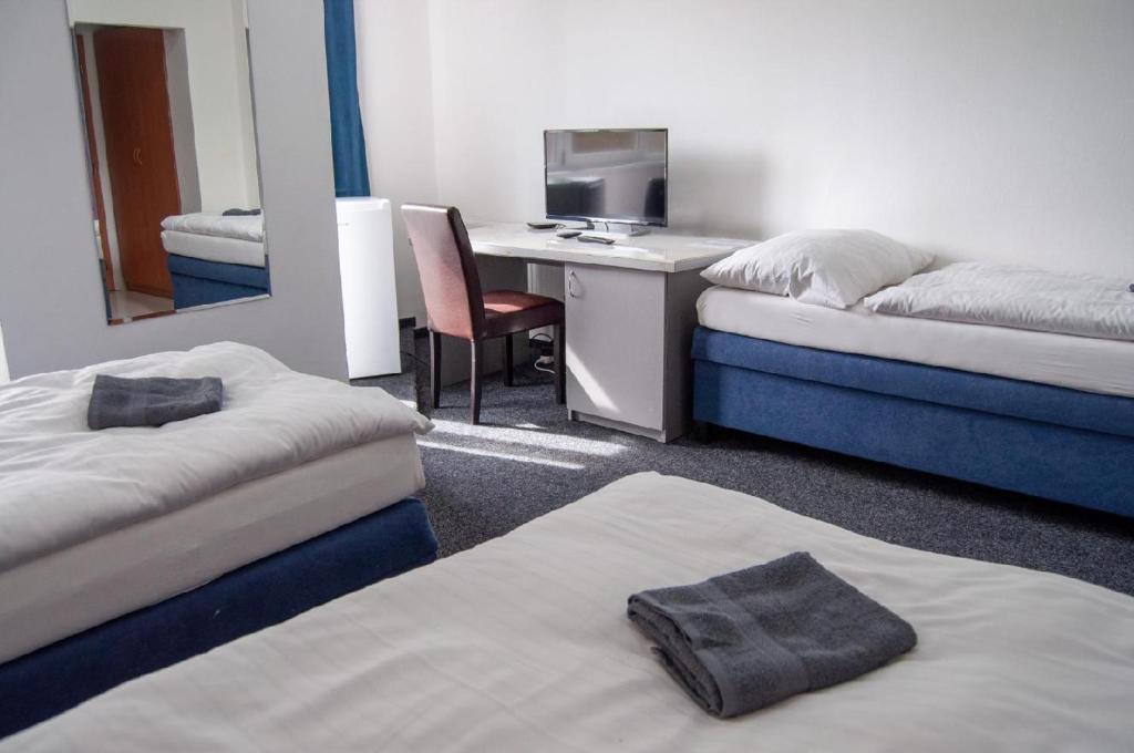 Postel nebo postele na pokoji v ubytování Hotel Joker