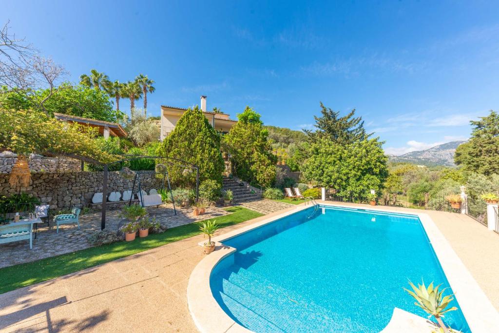 a swimming pool in the backyard of a house at Casa S'Olivaret -Selva- in El Port de la Selva