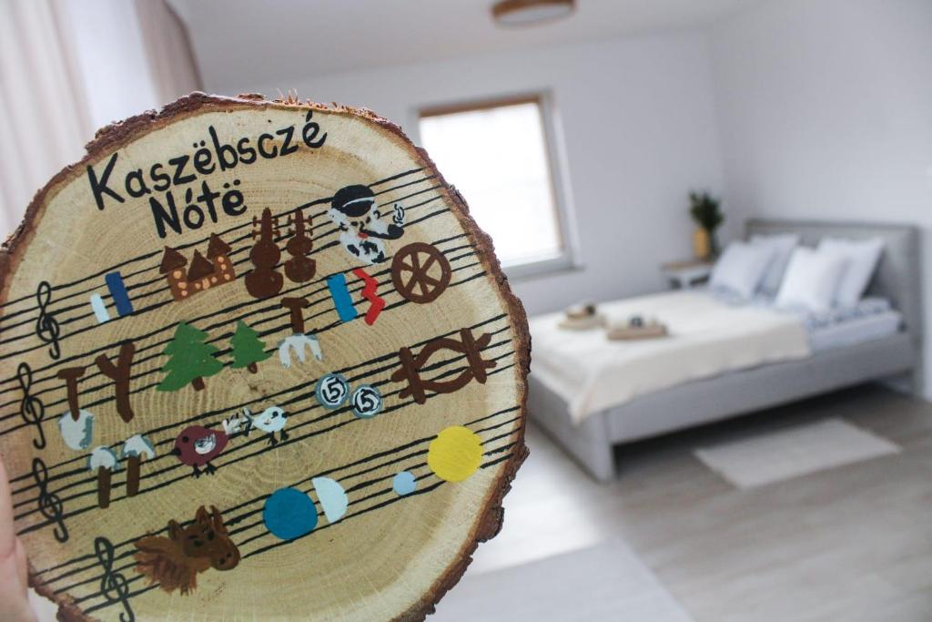 Postel nebo postele na pokoji v ubytování Dworek Wiatrów