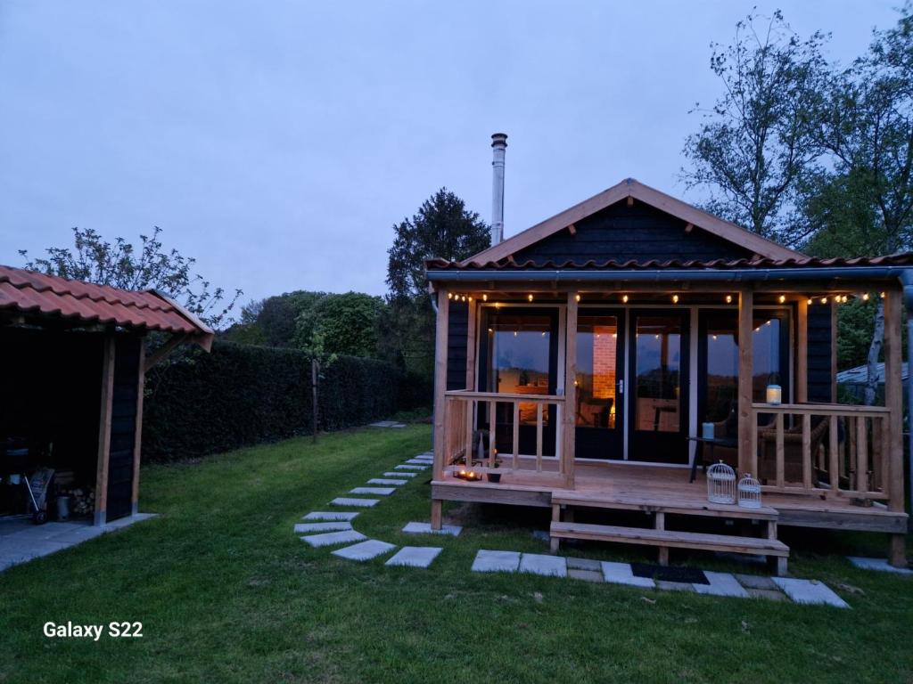 a gazebo in the yard of a house at Huys de Landerije in Wouwsche Plantage