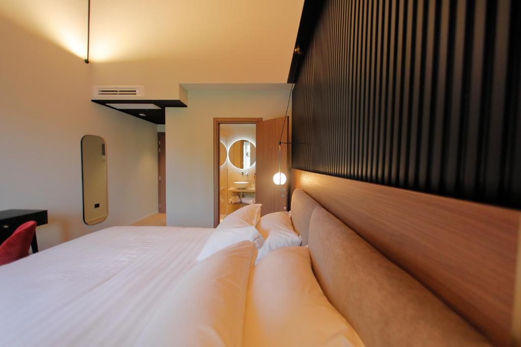 Postel nebo postele na pokoji v ubytování Hotel Namia by Dori