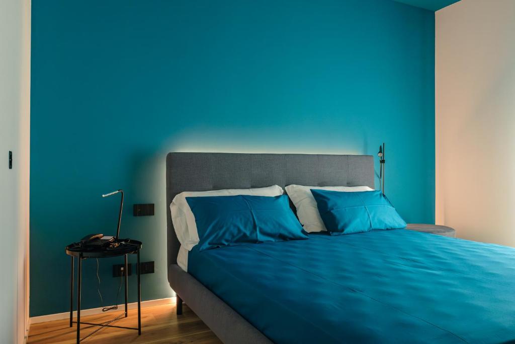 Postel nebo postele na pokoji v ubytování Camoma Aparthotel - Suites Apartments