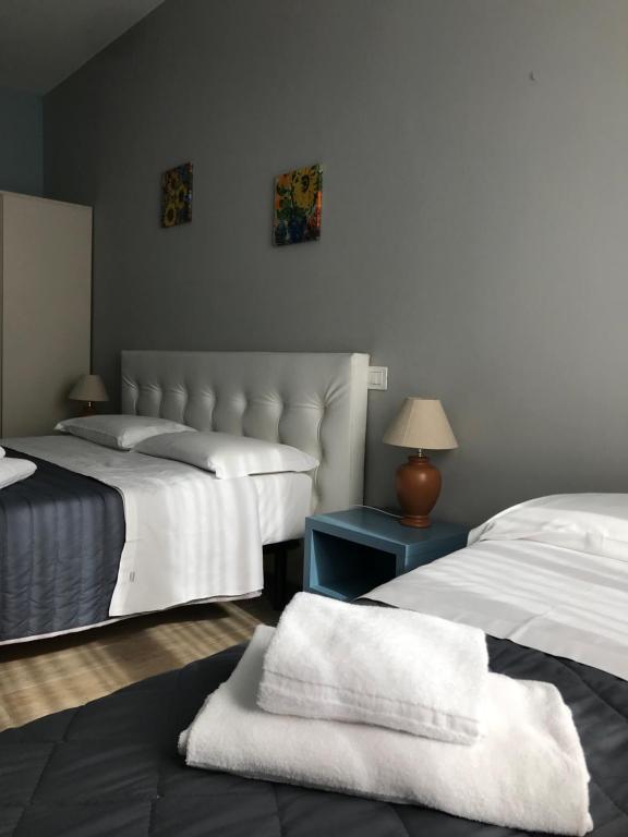 Postel nebo postele na pokoji v ubytování Camere Girasole