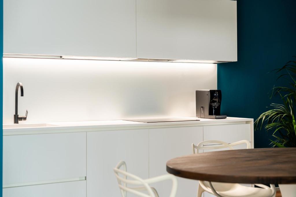 Kuchyň nebo kuchyňský kout v ubytování Camoma Aparthotel - Suites Apartments