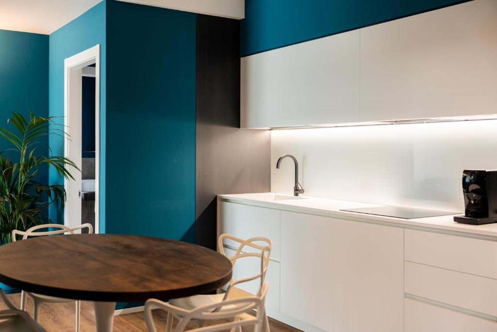 Kuchyň nebo kuchyňský kout v ubytování Camoma Aparthotel - Suites Apartments