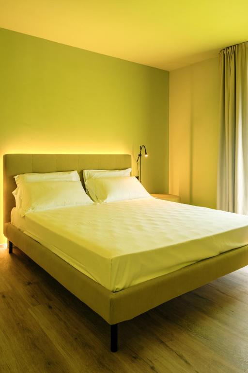 Postel nebo postele na pokoji v ubytování Camoma Aparthotel - Suites Apartments