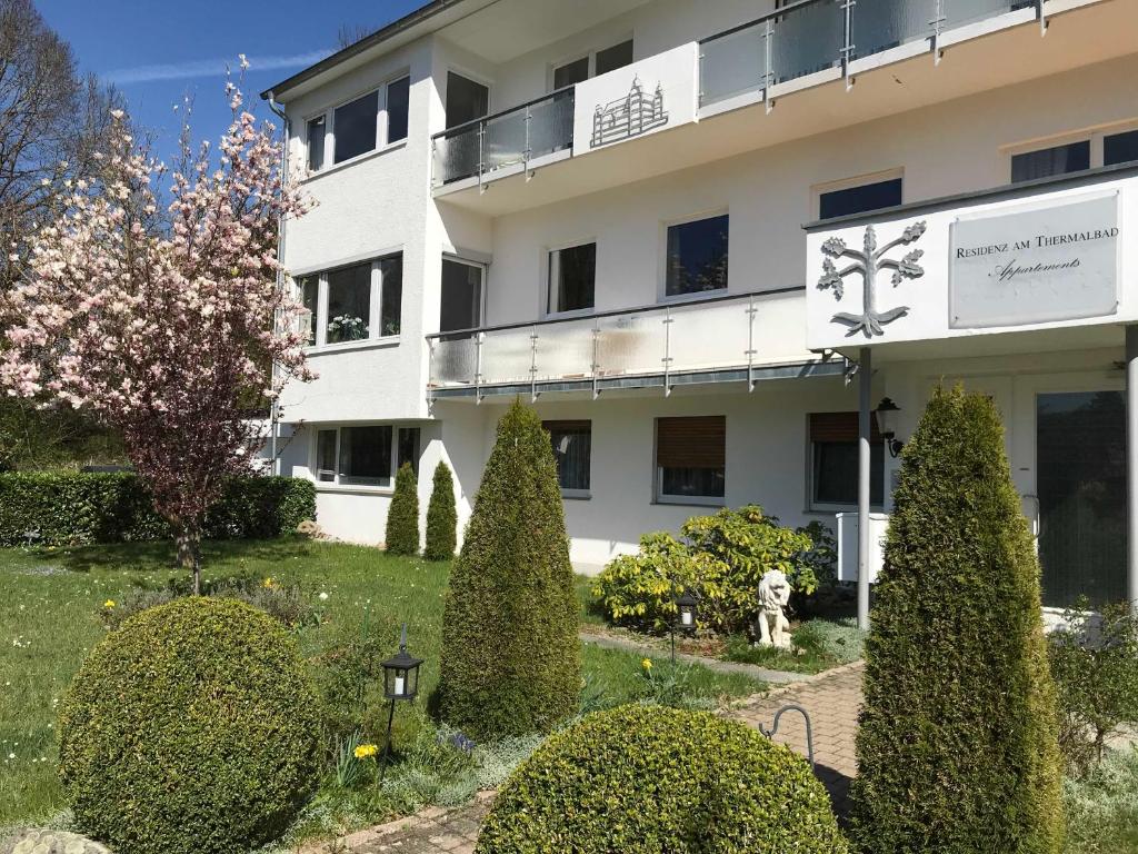 a building with a garden in front of it at Residenz am Thermalbad in Bad Waldsee