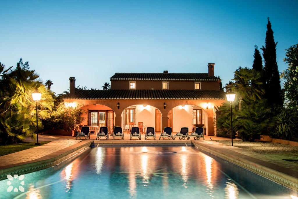 una gran piscina frente a una casa en Villa Benimarco by Abahana Villas en Benissa