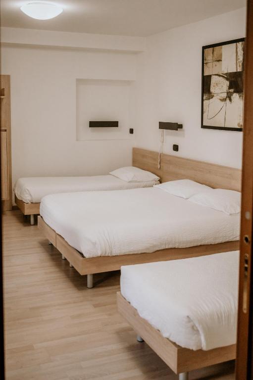 Postel nebo postele na pokoji v ubytování Hotel Venezia