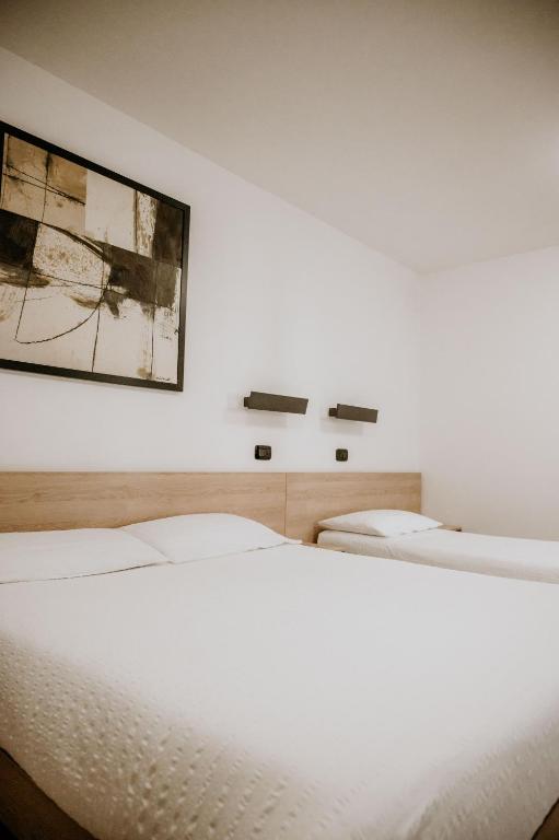 Postel nebo postele na pokoji v ubytování Hotel Venezia