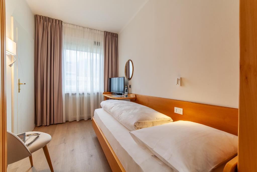 Postel nebo postele na pokoji v ubytování Hotel Isabella