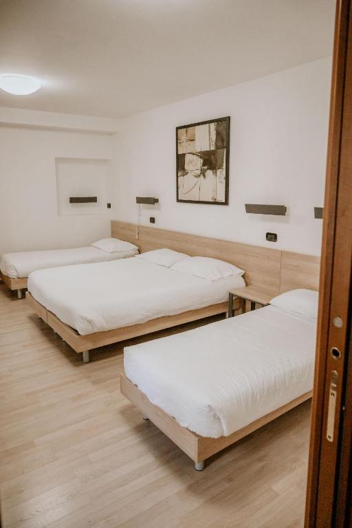 Postel nebo postele na pokoji v ubytování Hotel Venezia