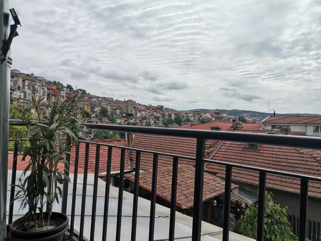 a balcony with a view of a city at Аврамов дом - етаж от къща in Veliko Tŭrnovo