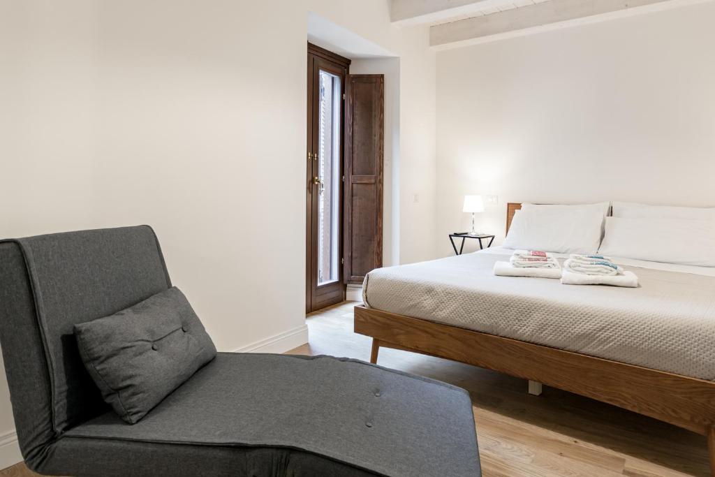 Posteľ alebo postele v izbe v ubytovaní B&B Vico Suites