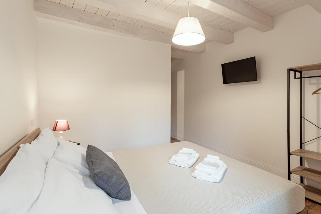 Posteľ alebo postele v izbe v ubytovaní B&B Vico Suites