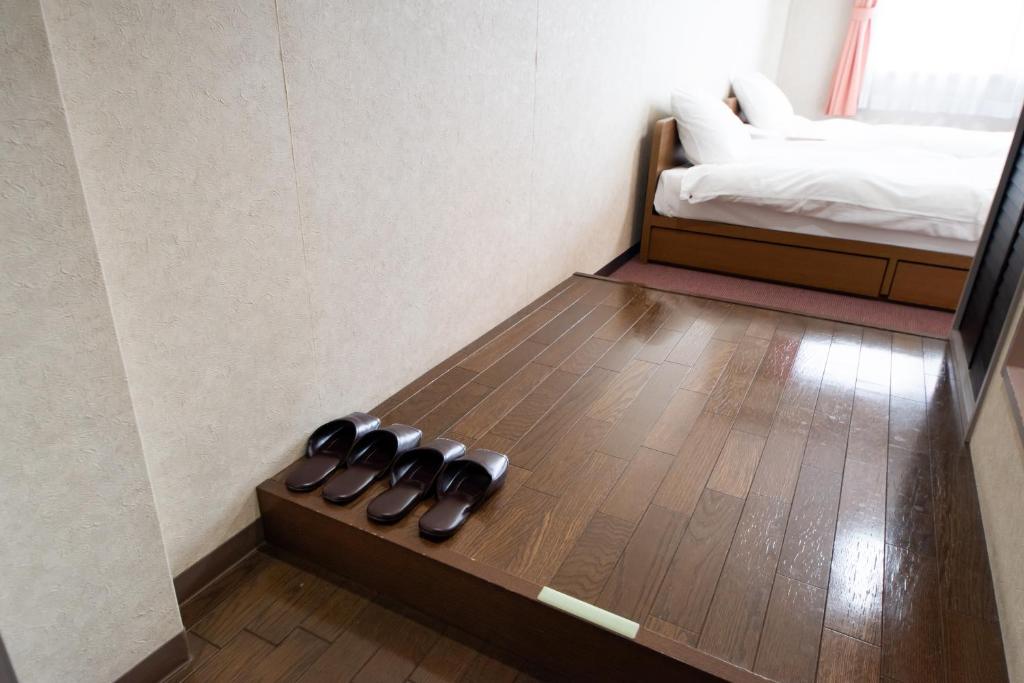 Postel nebo postele na pokoji v ubytování Yamato Saidaiji Hotel SINDAI