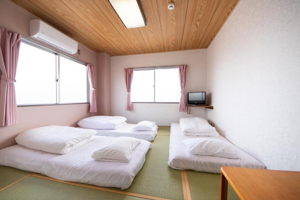 Postel nebo postele na pokoji v ubytování Yamato Saidaiji Hotel SINDAI
