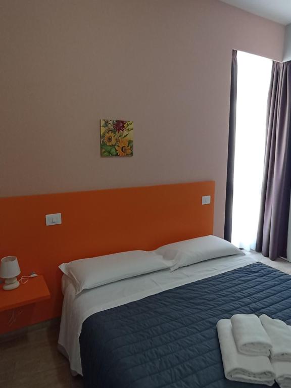 Postel nebo postele na pokoji v ubytování Camere Girasole
