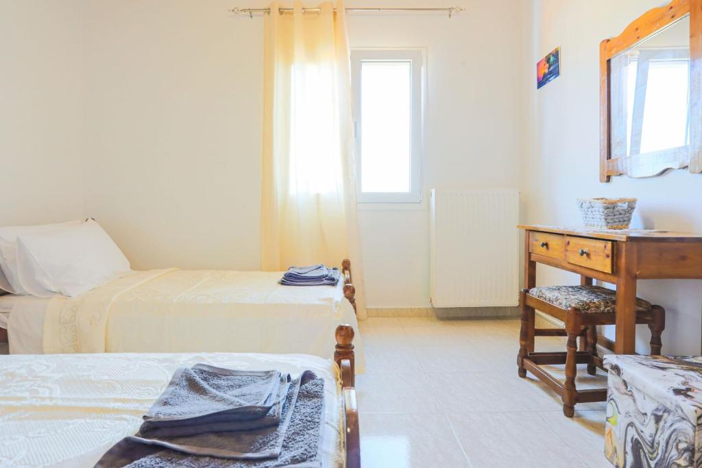 Postel nebo postele na pokoji v ubytování Andromaxi Apt