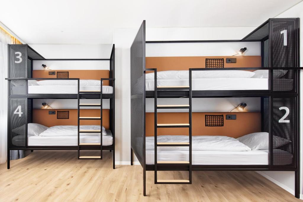 Postel nebo postele na pokoji v ubytování H2 Hotel Wien Schönbrunn