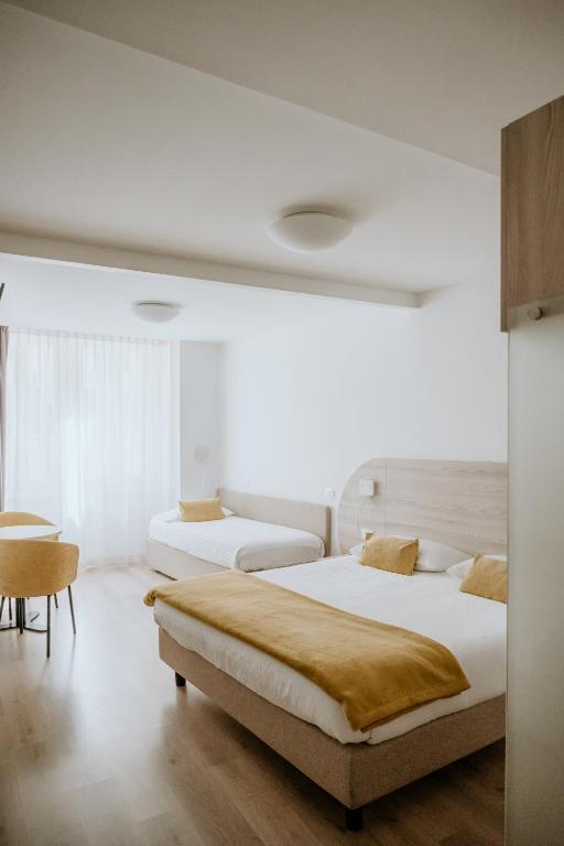 Postel nebo postele na pokoji v ubytování Hotel Venezia