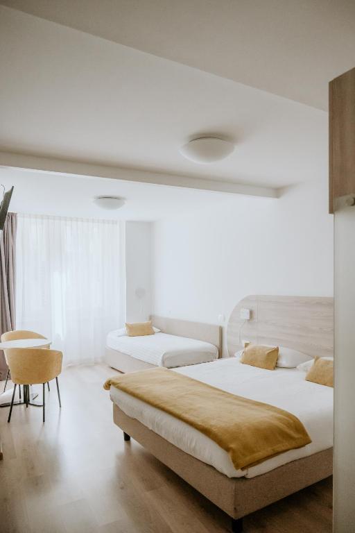 Postel nebo postele na pokoji v ubytování Hotel Venezia