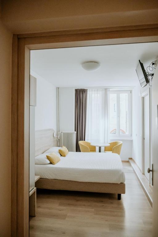Postel nebo postele na pokoji v ubytování Hotel Venezia