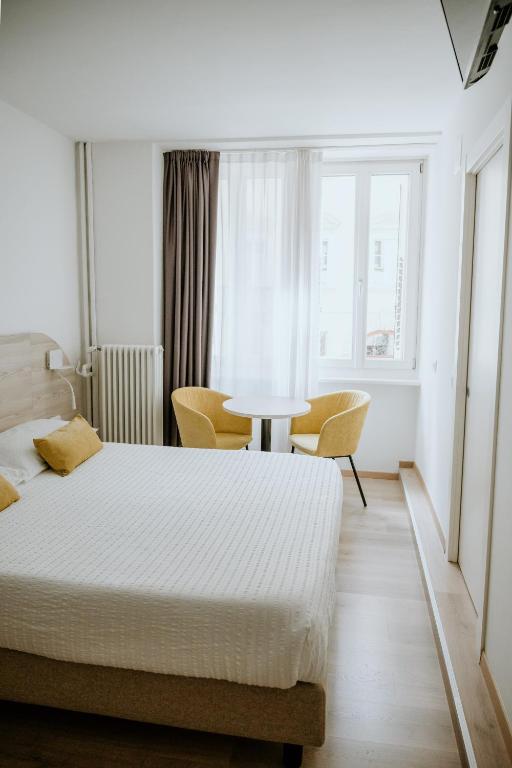 Postel nebo postele na pokoji v ubytování Hotel Venezia
