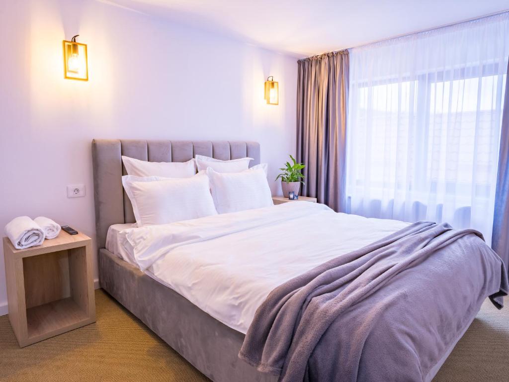 Postel nebo postele na pokoji v ubytování Casa Zuz Voronet