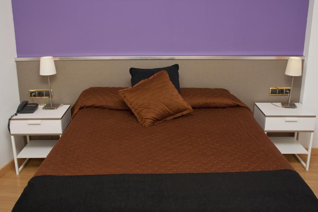 Llit o llits en una habitació de Hotel Abbot