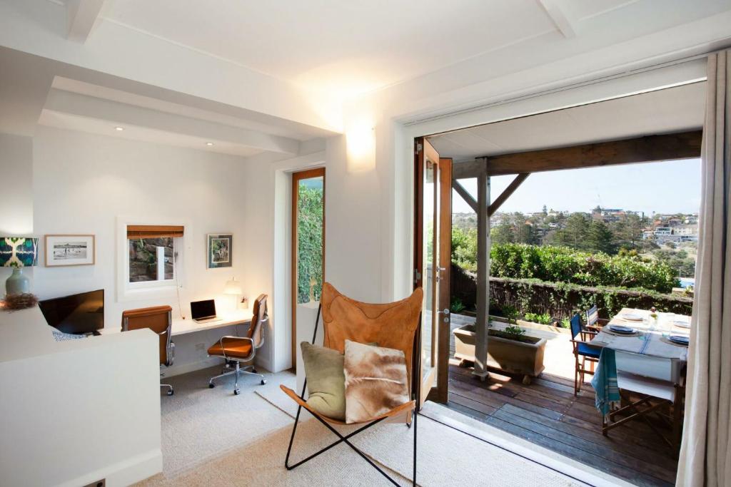 a home office with a view of a balcony at Barefoot in Bronte IH in Sydney