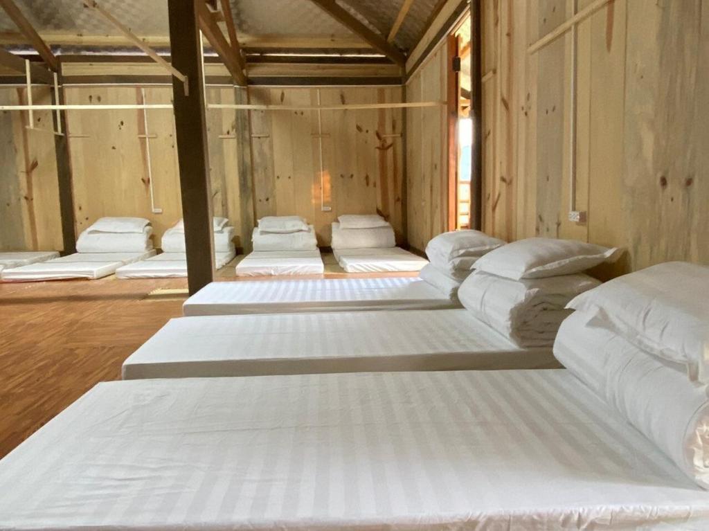 Katil atau katil-katil dalam bilik di Doi Tung Tang Homestay