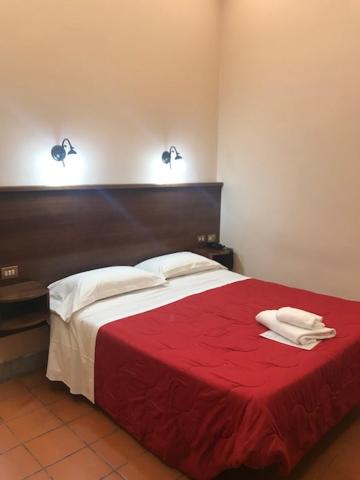 Postel nebo postele na pokoji v ubytování Hotel Panda