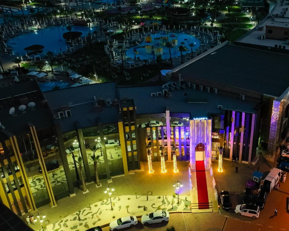 an aerial view of a city at night at Waves Aqua Resort in Kenitra