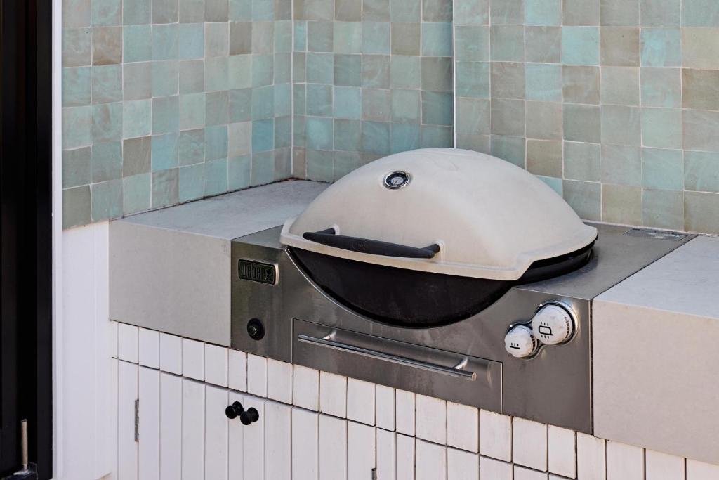 a white helmet on a counter in a bathroom at Royal Redfern Isyd in Sydney