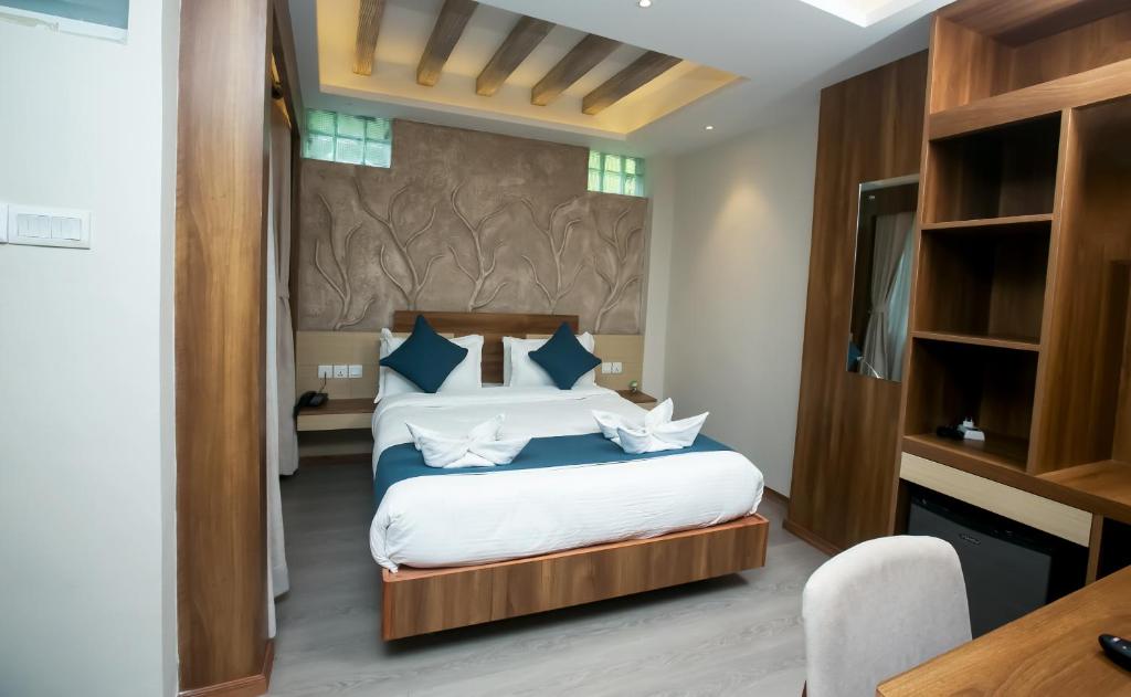 Postel nebo postele na pokoji v ubytování Hotel Maya Boutique & Apartment