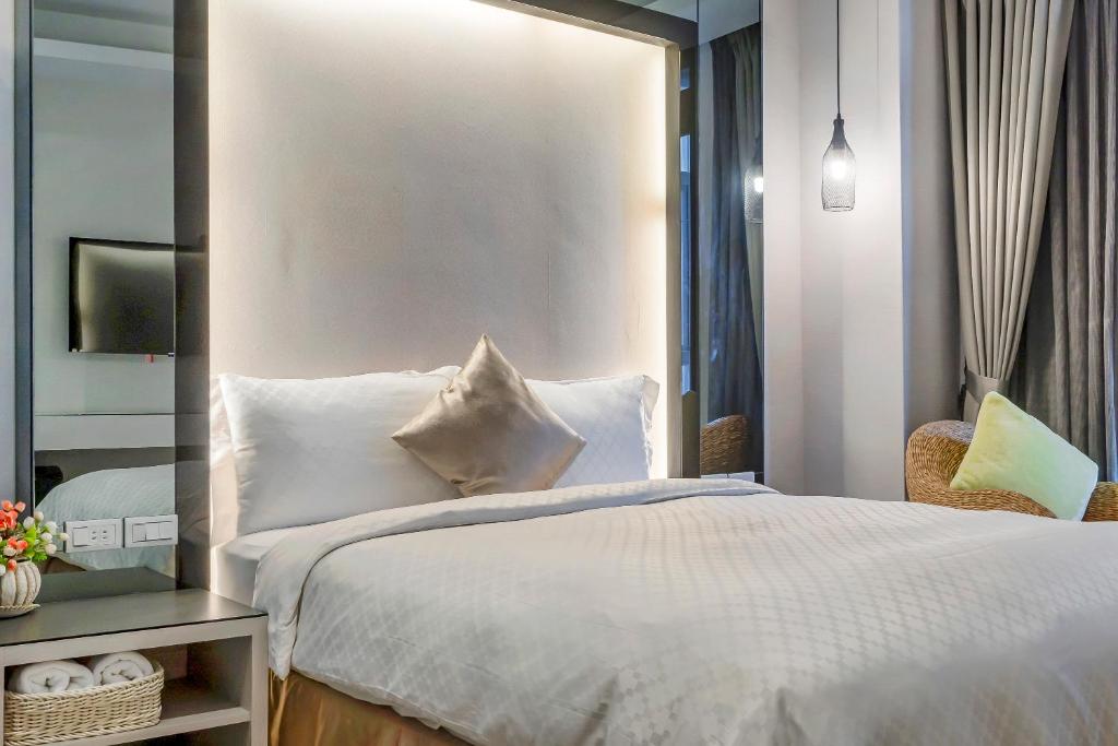 Postel nebo postele na pokoji v ubytování Pacific Inn