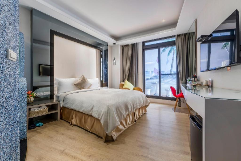 Postel nebo postele na pokoji v ubytování Pacific Inn