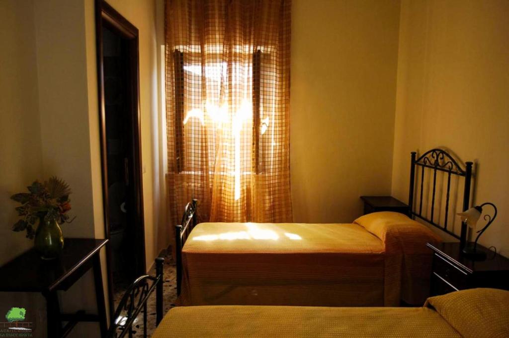 Postel nebo postele na pokoji v ubytování La Staccionata