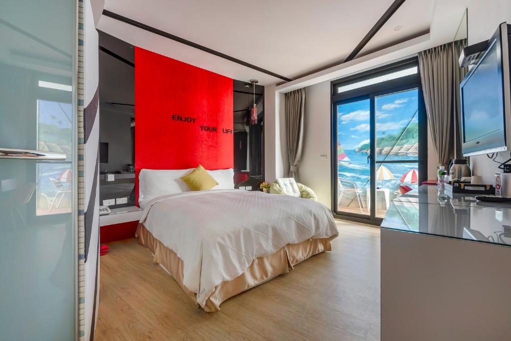 Postel nebo postele na pokoji v ubytování Pacific Inn