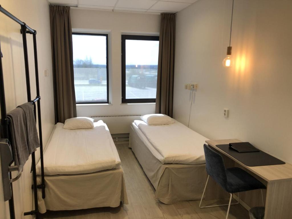 Postel nebo postele na pokoji v ubytování Hotell Fyrislund