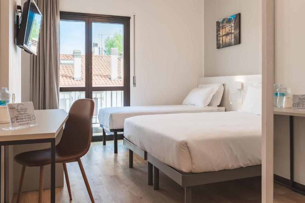 Postel nebo postele na pokoji v ubytování CENTRO HOTEL - Venice Airport