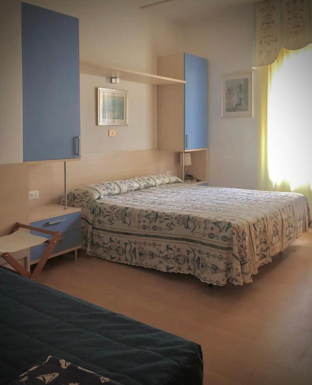 Postel nebo postele na pokoji v ubytování Hotel La Parigina