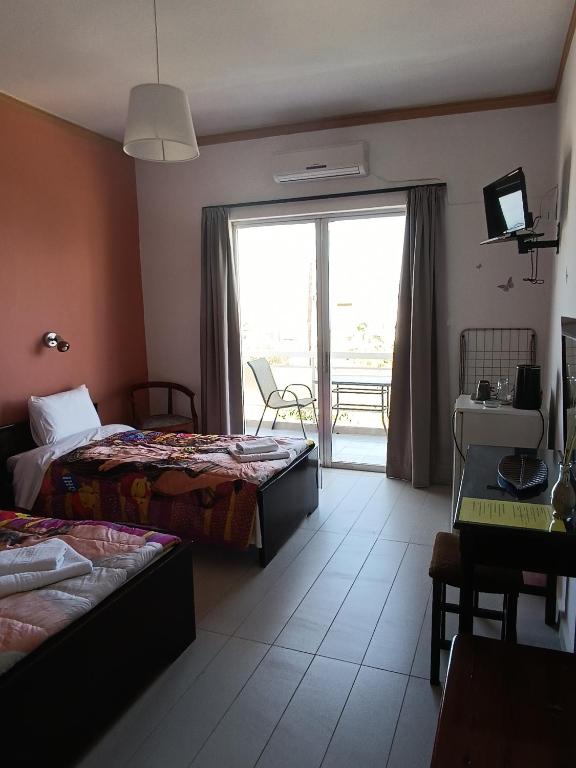 Postel nebo postele na pokoji v ubytování GOLDEN BEACH