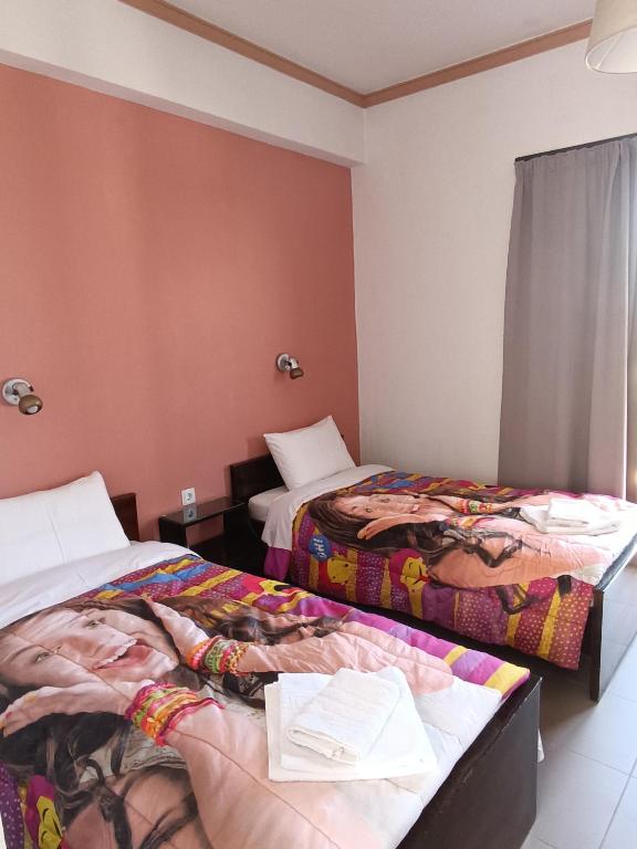 Postel nebo postele na pokoji v ubytování GOLDEN BEACH